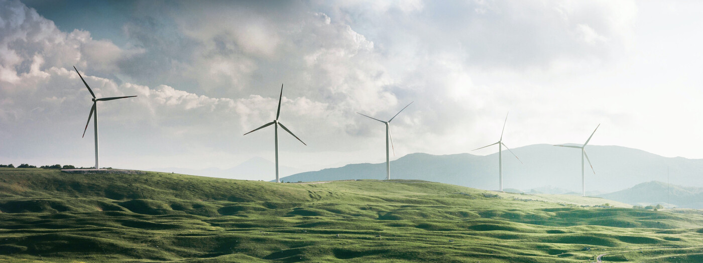 Wind turbines in green fields